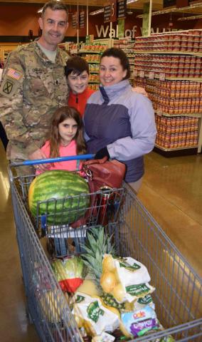 Military family shopping in commissary Thumbnail