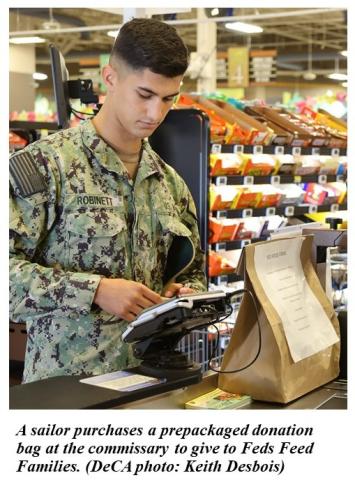 Sailor purchases prepackaged bag to donate to Feds Feed Families